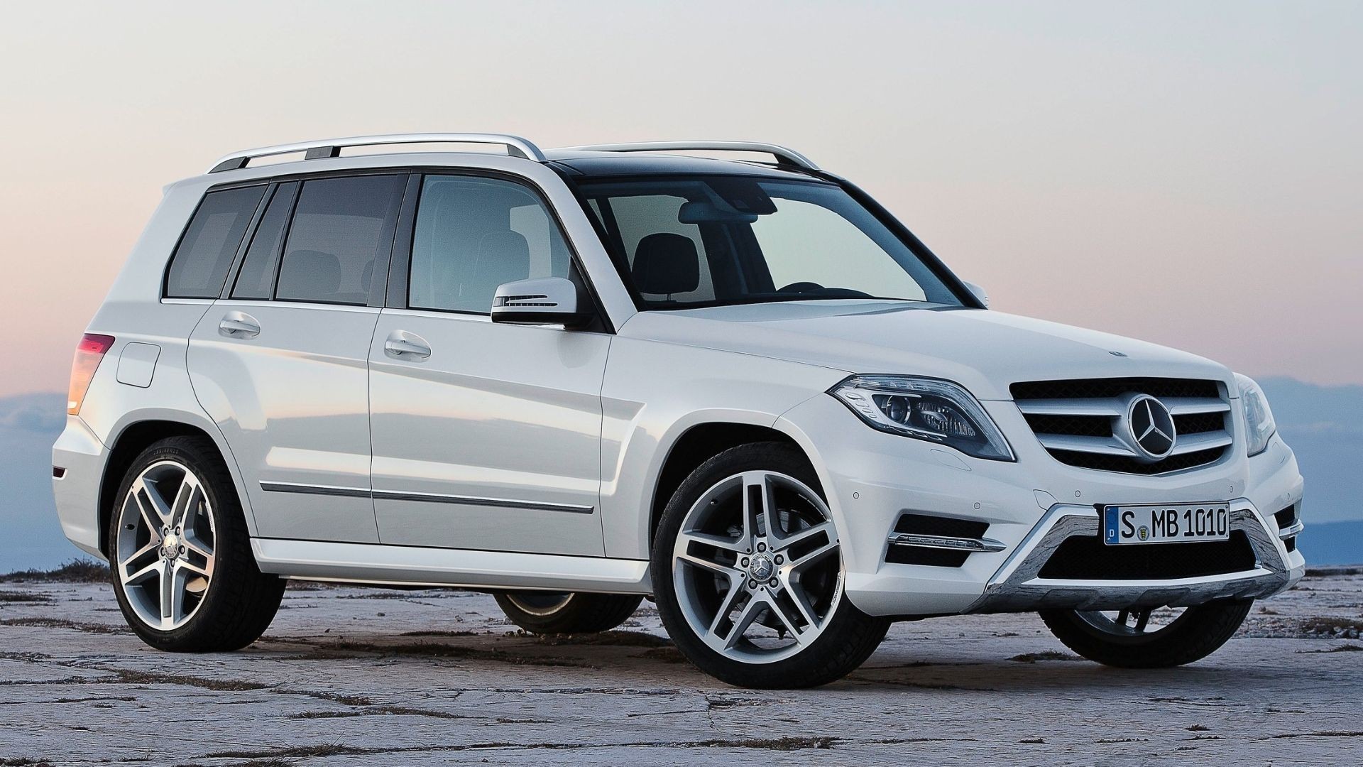 White 2013 Mercedes-Benz GLK-Class pictured outdoors, showcasing its boxy and functional SUV shape.