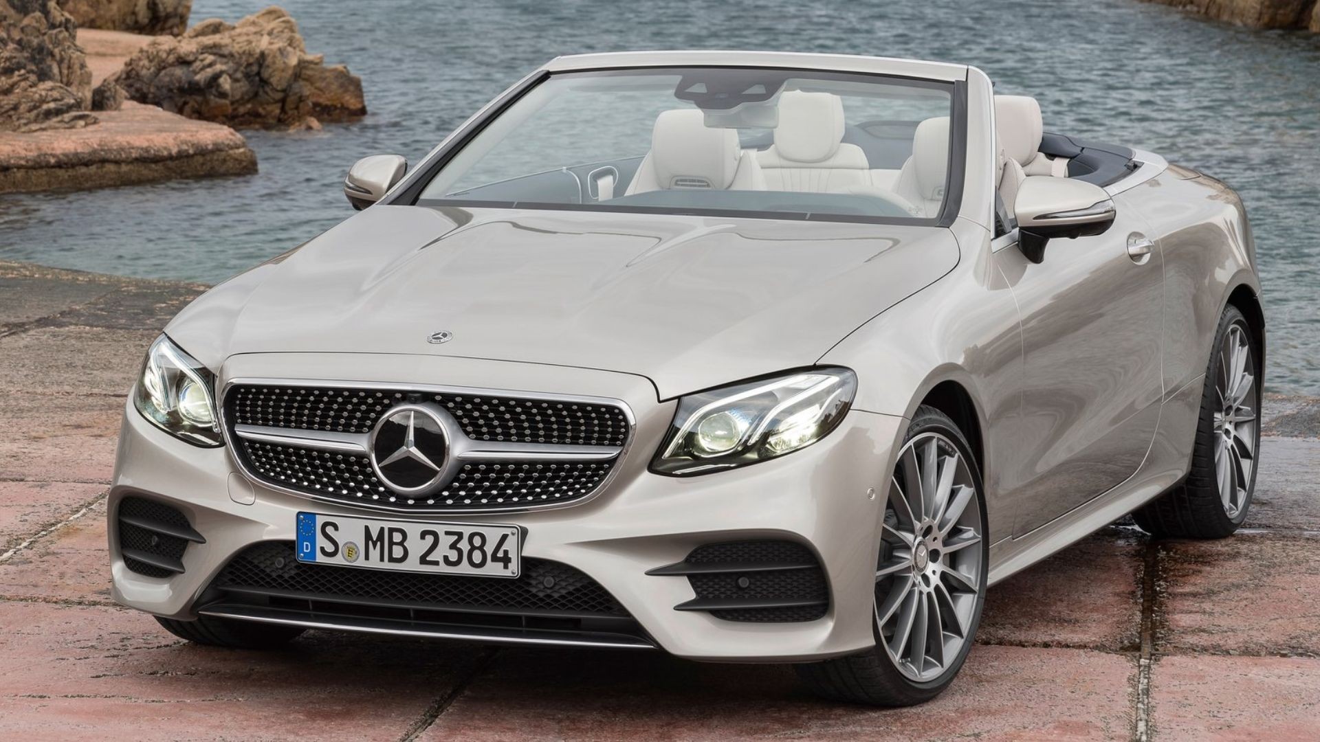 Silver 2019 Mercedes-Benz E-Class parked, showcasing its pre-facelift fifth-generation design.