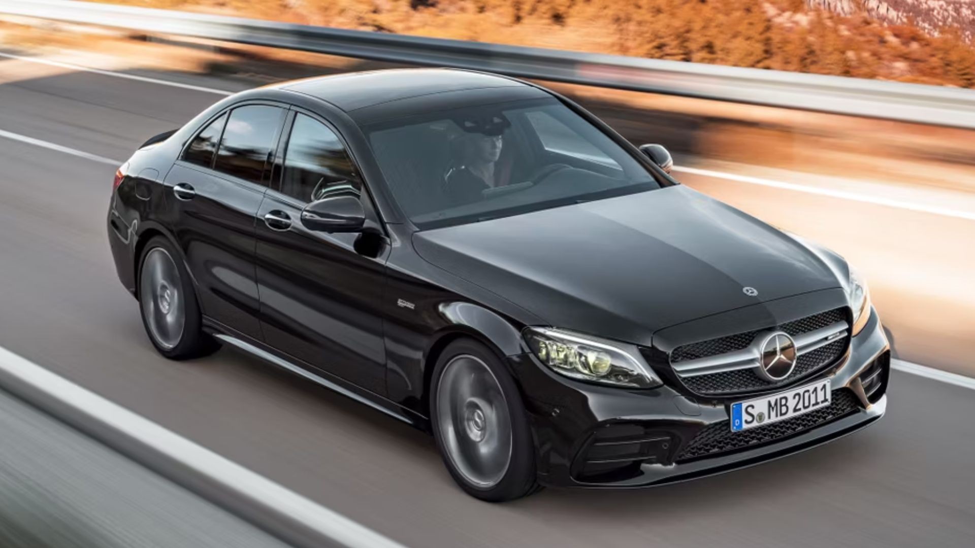 Black 2021 Mercedes-AMG C43 showcasing its sporty sedan stance and AMG styling cues.