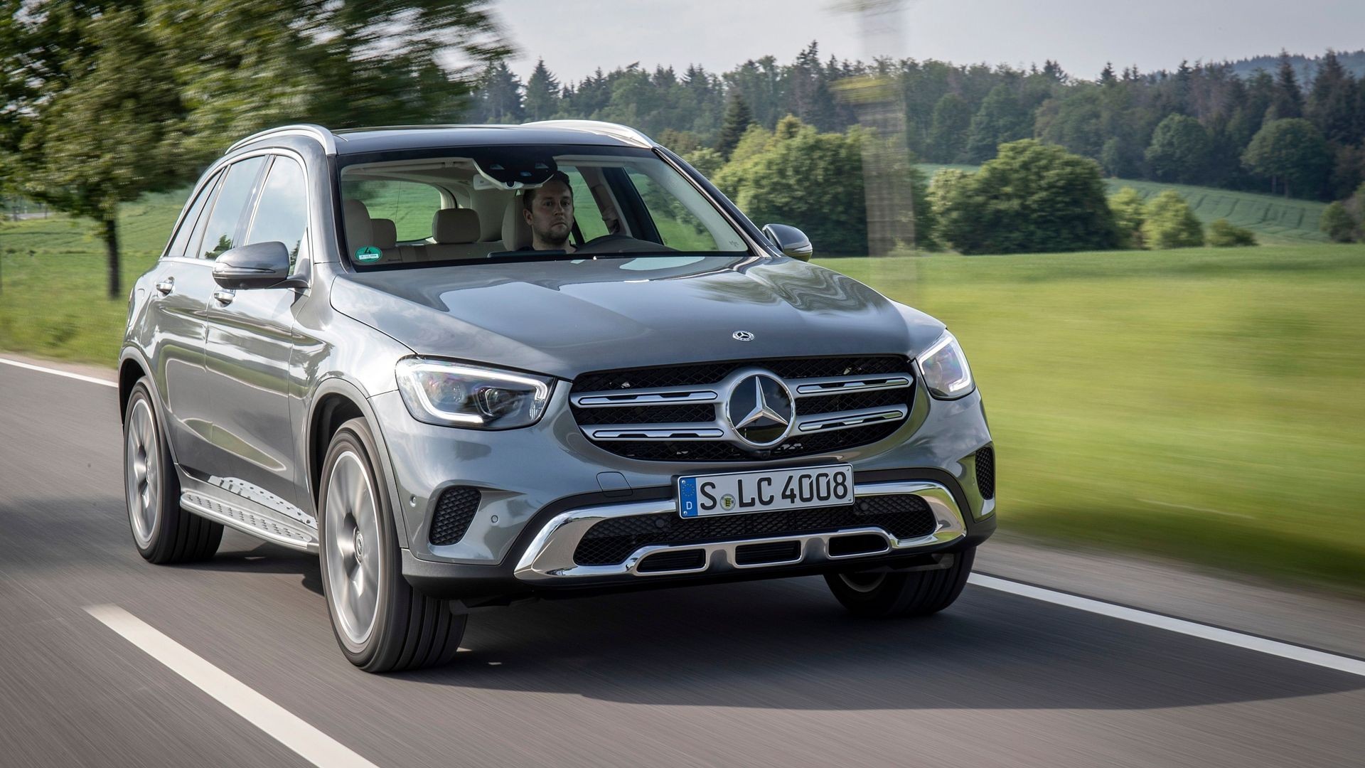 Grey 2021 Mercedes-Benz GLC 300 elegantly parked, highlighting its refined crossover SUV design.