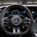 Mercedes-AMG GT interior front dash showcasing the luxurious and sporty design, highlighting the advanced technology and driver-focused cockpit.