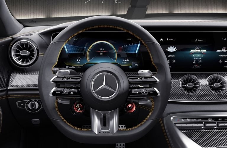 Mercedes-AMG GT interior front dash showcasing the luxurious and sporty design, highlighting the advanced technology and driver-focused cockpit.