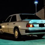 Front view of a 1990 Mercedes Benz 300E showcasing its iconic grille and headlights