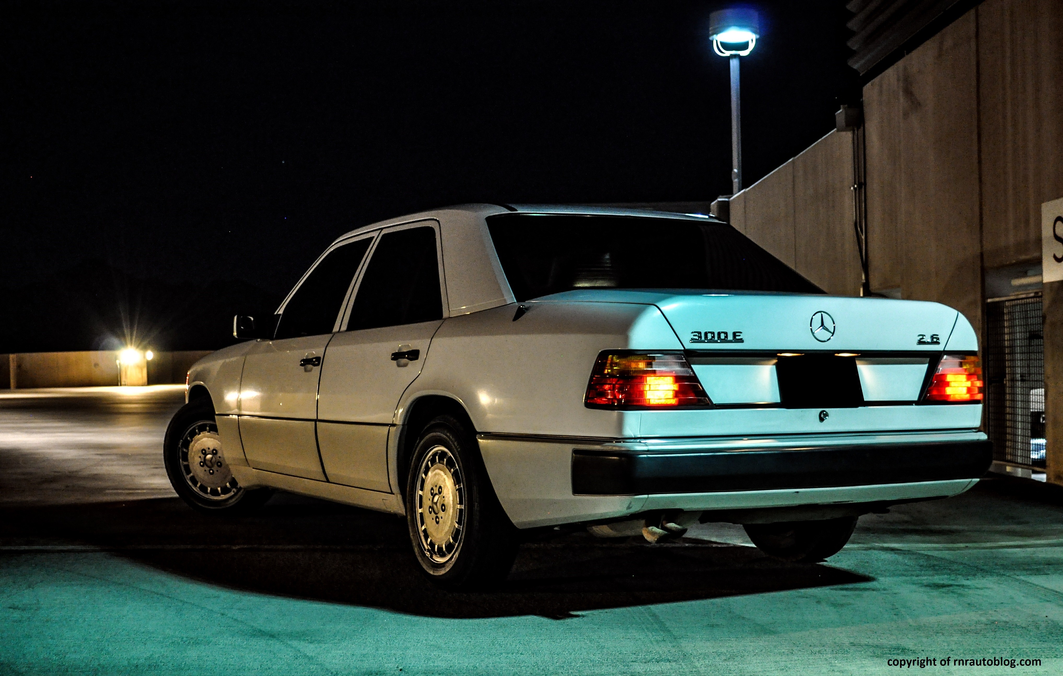 Front view of a 1990 Mercedes Benz 300E showcasing its iconic grille and headlights