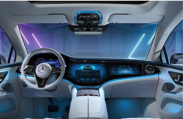 Mercedes-Benz dashboard illuminated with soft blue ambient interior lighting.