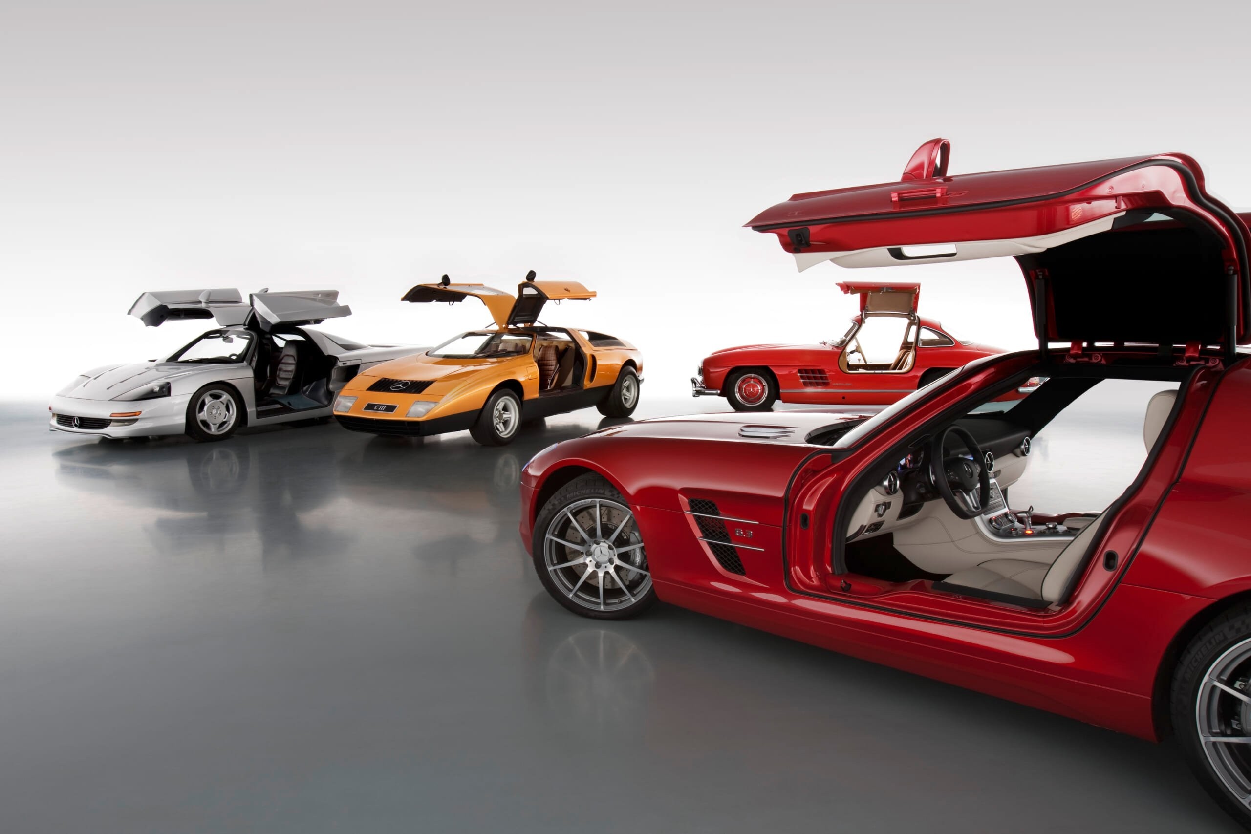 Mercedes-Benz Gullwing Family showcasing various models with wing doors