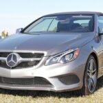 Front view of the silver 2014 Mercedes-Benz E350 Cabriolet showcasing its updated headlight design.