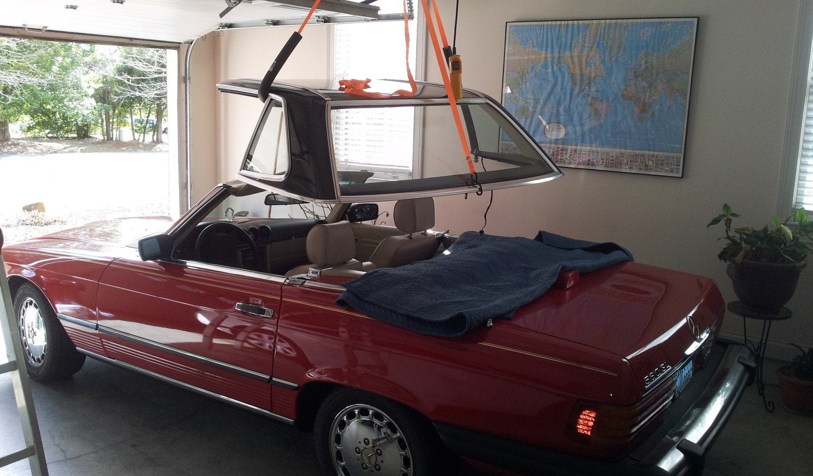 Mercedes-Benz 560SL hardtop storage hoist in a garage